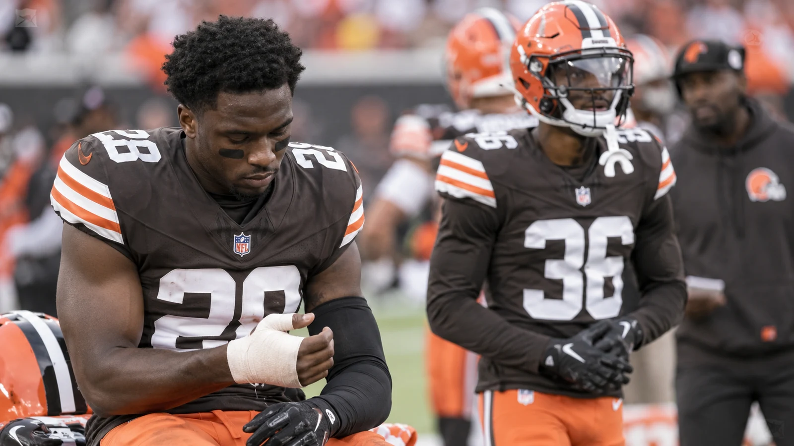 Cleveland Browns defensive backs on the sideline during a Week 2 injury update