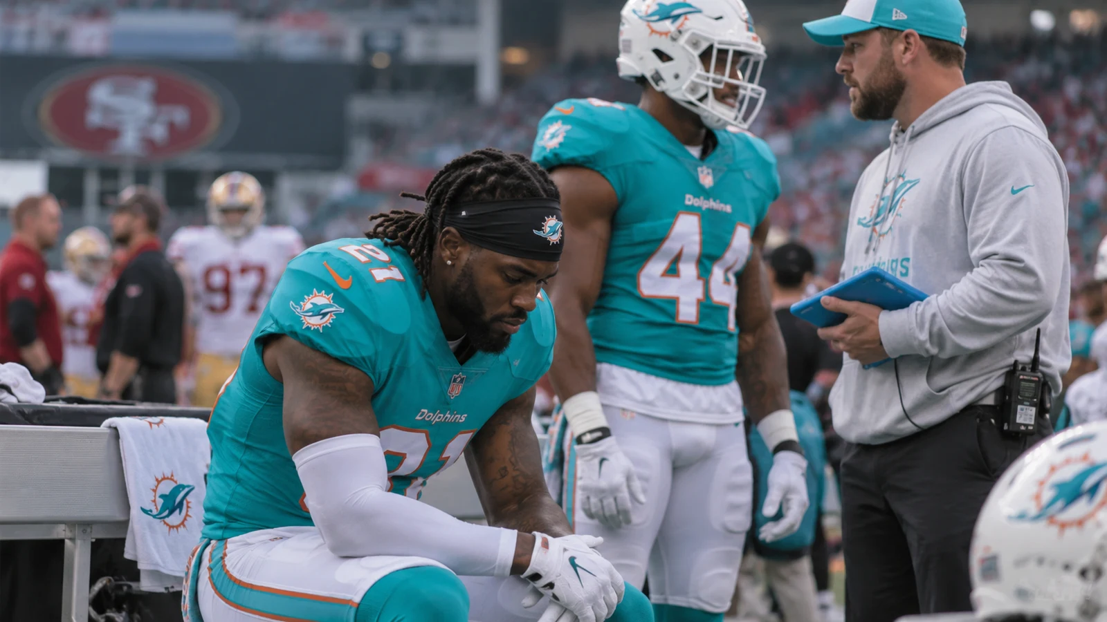 Miami Dolphins sideline during a defensive roster and injury update before the 49ers game