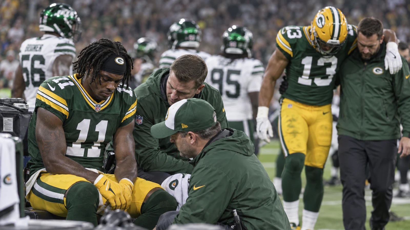 Green Bay Packers players receiving medical attention after injuries against the New York Jets