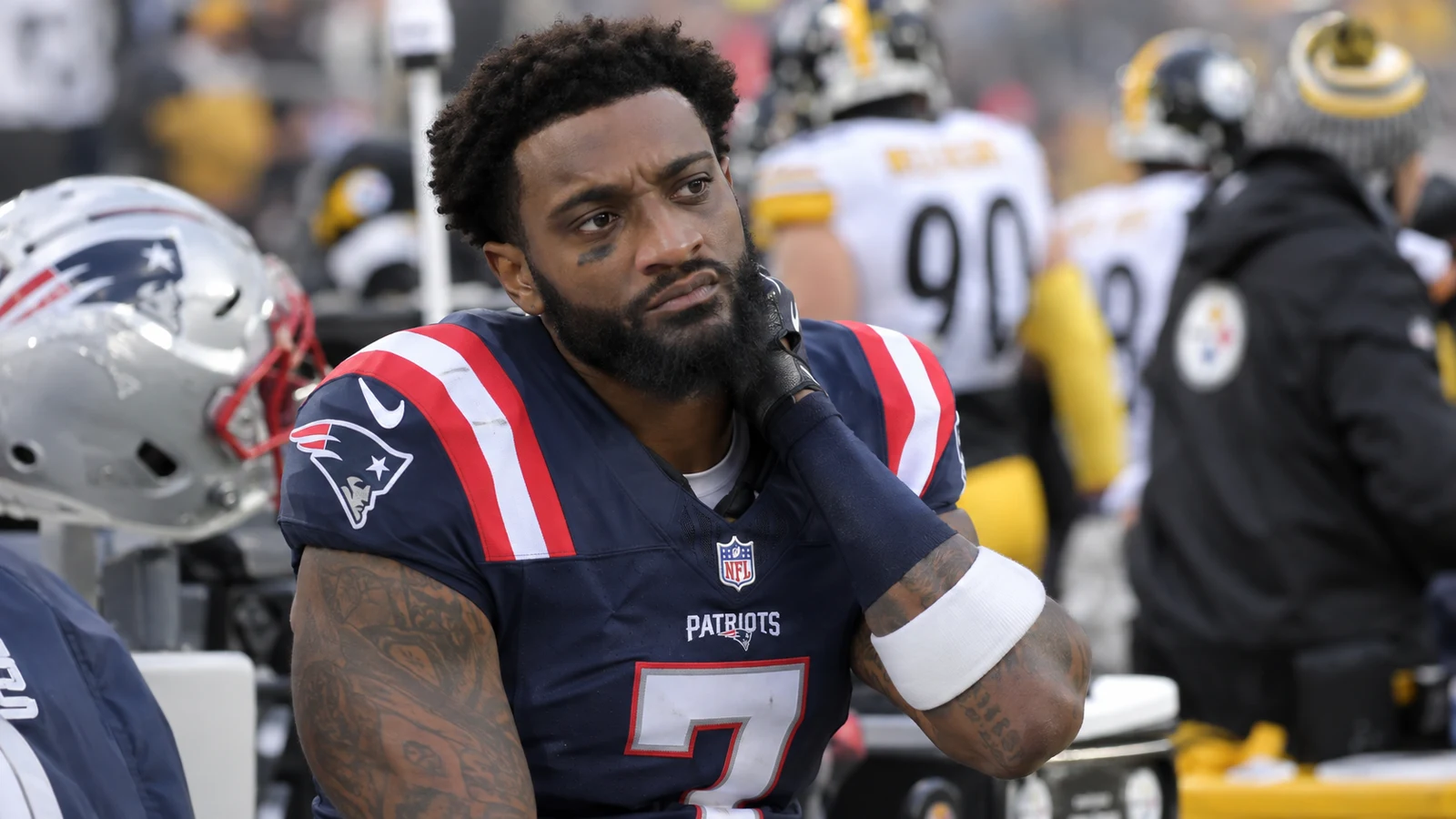 New England Patriots defensive back on the sideline with a neck injury