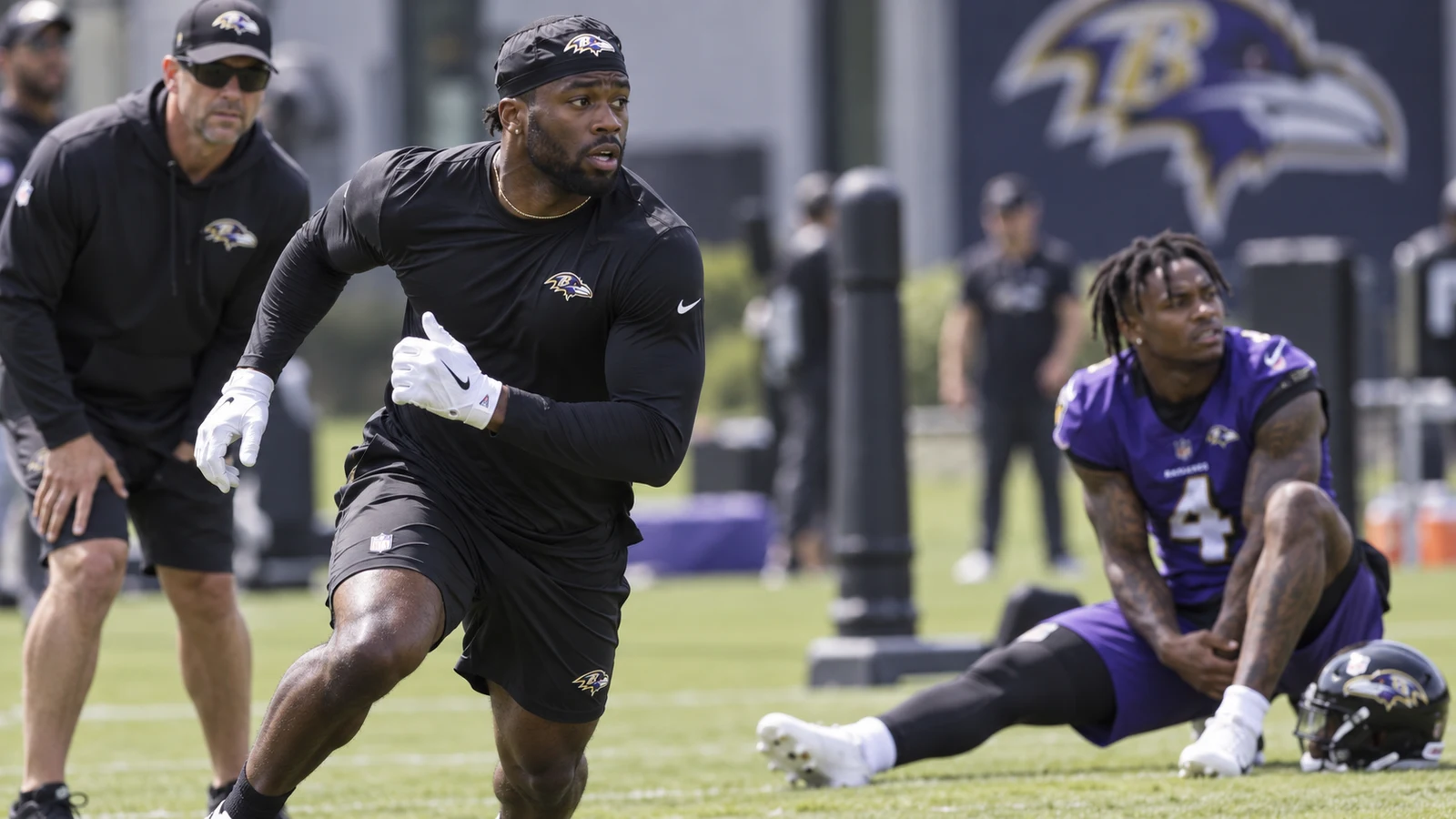 Baltimore Ravens receiver workout scene as the team evaluates Brandin Cooks while Zay Flowers misses practice.